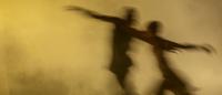 blurry depiction of two modern dancers